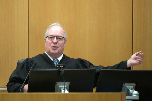 Maricopa County Superior Court Judge Mark H. Brain gestures to a witness during the sentencing hearing of Cleophus Cooksey Jr. after being convicted of killing eight people during his trial Monday, Sept. 29, 2025, in Phoenix. (AP Photo/Ross D. Franklin) Maricopa County Superior Court Judge Mark H. Brain gestures to a witness during the sentencing hearing of Cleophus Cooksey Jr. after being convicted of killing eight people during his trial Monday, Sept. 29, 2025, in Phoenix. (AP Photo/Ross D. Franklin)