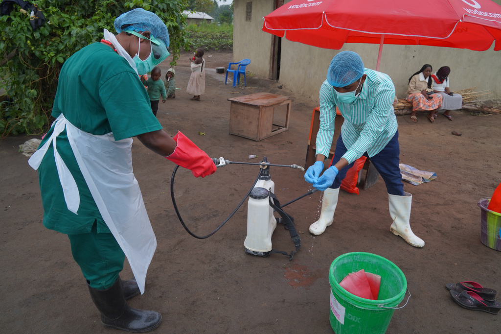 Wiza Bondele, Right, a health worker on the prevention and control team, seen at work in Ituri province, eastern Congo, Wednesday, Aug 5, 2026. (AP Photo/Dieudonne Dirole)