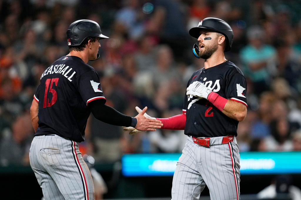 Minnesota Twins' Kody Clemens (2) celebrates his two-run home run with Luke Keaschall (15) against the Detroit Tigers during the sixth inning of a baseball game Tuesday, Sept. 8, 2026, in Detroit. (AP Photo/Paul Sancya)