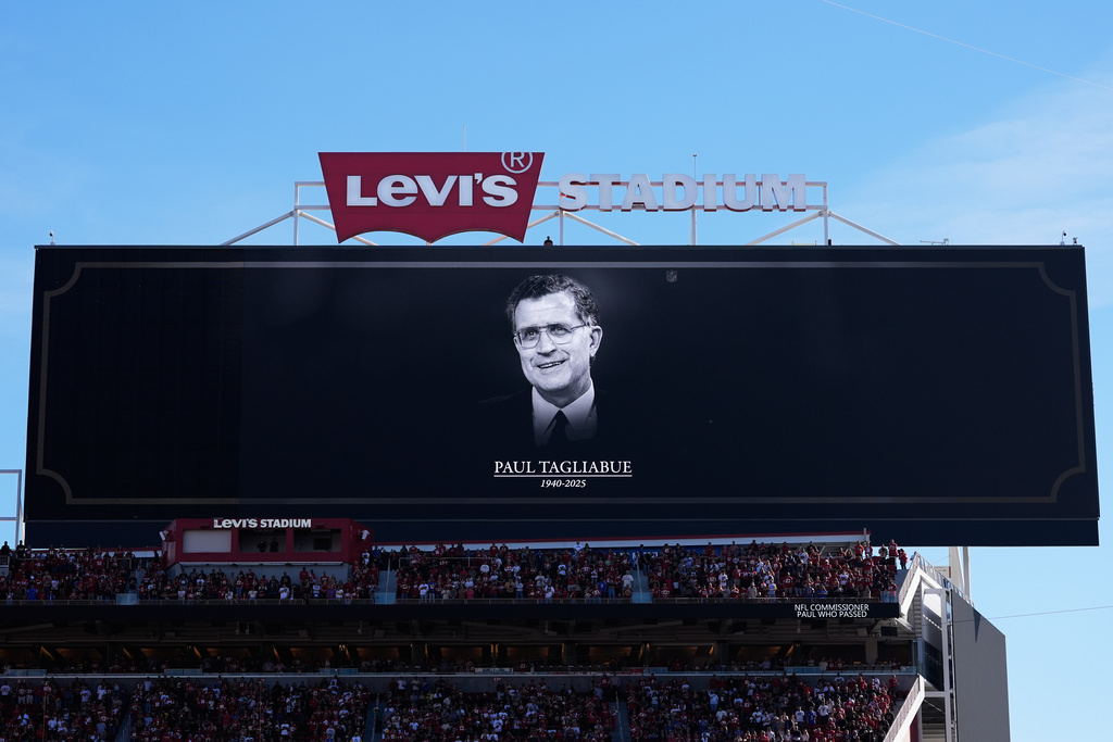 A message is shown on a video board during a moment of silence in honor of former NFL Commissioner Paul Tagliabue before an NFL football game between the San Francisco 49ers and the Los Angeles Rams in Santa Clara, Calif., Sunday, Nov. 9, 2025. (AP Photo/Godofredo A. Vásquez)