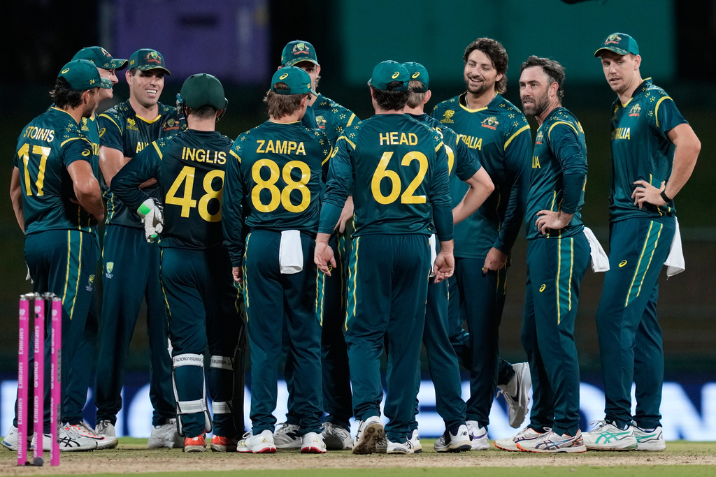 Australia's Glenn Maxwell, second right, celebrates with teammates the wicket of Oman's Jiten Ramanandi during the T20 World Cup cricket match between Australia and Oman in Pallekele, Sri Lanka, Friday, Feb. 20, 2026. (AP Photo/Eranga Jayawardena)