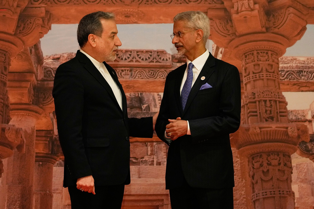 India's Foreign Minister S. Jaishankar, right, speaks with Iranian Foreign Minister Abbas Araghchi as he arrives for a two-day BRICS nations meeting in New Delhi, India, Thursday, May 14, 2026. (AP Photo/Manish Swarup)