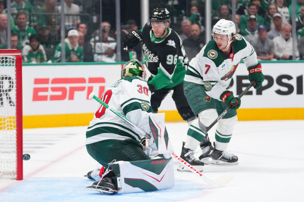 A shot by Dallas Stars defenseman Miro Heiskanen, not visible, gets by Minnesota Wild goaltender Jesper Wallstedt (30) for a goal during the first period in Game 5 of a first-round NHL Stanley Cup playoffs hockey series, Tuesday, April 28, 2026, in Dallas. (AP Photo/Julio Cortez)