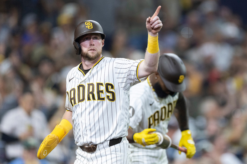 Jake Cronenworth celebrates after scoring off a single by Jackson Merrill in the sixth inning of a baseball game against the Minessota Twins Saturday, Aug. 22, 2026, in San Diego, Calif. (AP Photo/Karl Anderson)