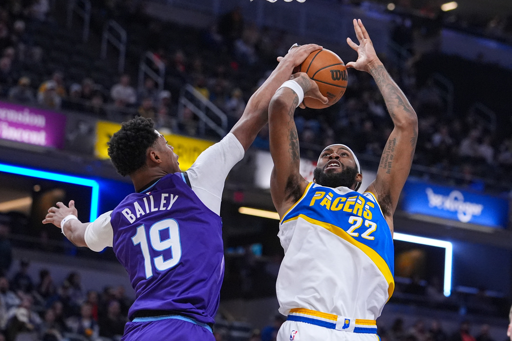Utah Jazz forward Ace Bailey (19) blocks the shot of Indiana Pacers forward Isaiah Jackson (22) during the second half of an NBA basketball game in Indianapolis, Tuesday, Feb. 3, 2026. (AP Photo/Michael Conroy)