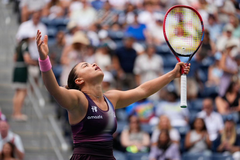 Jasmine Paolini, of Italy, reacts during the first round of the U.S. Open tennis championships against Veronika Erjavec, of Slovenia, Sunday, Aug. 30, 2026, in New York. (AP Photo/Yuki Iwamura)