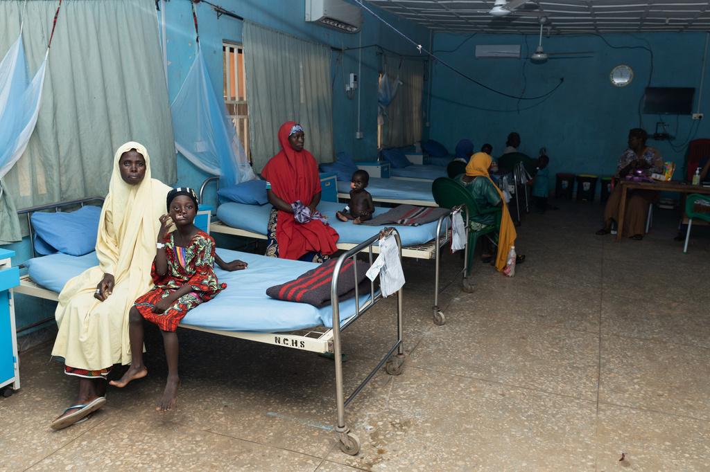 Hajira Sahabi, 2nd left, and other children who underwent facial reconstructive surgery to help them recover from noma disease, sit with relatives at the Noma Children Hospital in Sokoto, northwest Nigeria, Thursday, Sept. 3, 2026. (AP Photo/Ifeanyi Emmanuel)