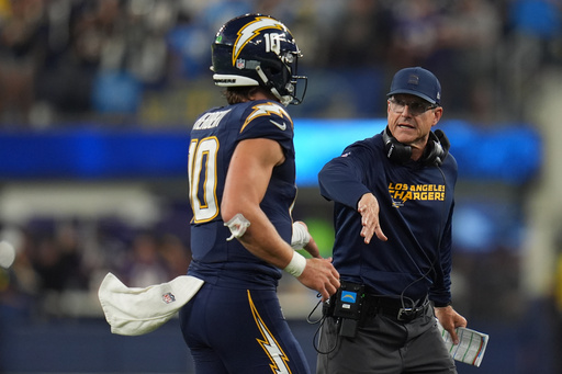 Los Angeles Chargers quarterback Justin Herbert (10) and head coach Jim Harbaugh celebrate after a touchdown by wide receiver Ladd McConkey (15) during the first half of an NFL football game against the Minnesota Vikings Thursday, Oct. 23, 2025, in Inglewood, Calif. (AP Photo/Gregory Bull) Los Angeles Chargers quarterback Justin Herbert (10) and head coach Jim Harbaugh celebrate after a touchdown by wide receiver Ladd McConkey (15) during the first half of an NFL football game against the Minnesota Vikings Thursday, Oct. 23, 2025, in Inglewood, Calif. (AP Photo/Gregory Bull)