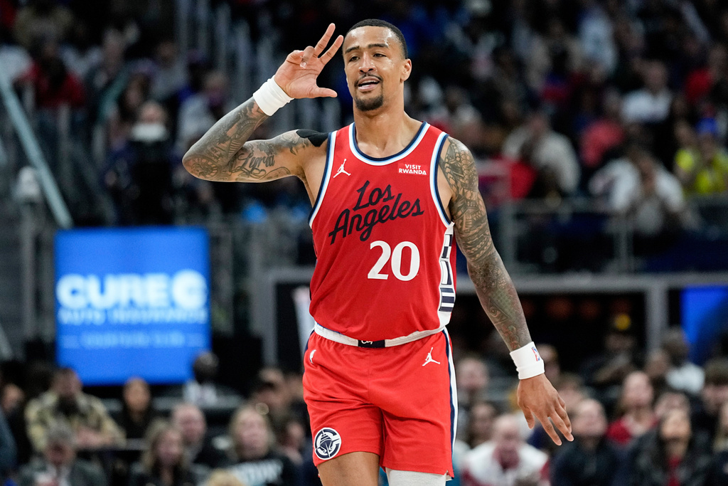 Los Angeles Clippers forward John Collins celebrates after a 3-point basket during the second half of an NBA basketball game against the Detroit Pistons, Saturday, Jan. 10, 2026, in Detroit. (AP Photo/Ryan Sun)