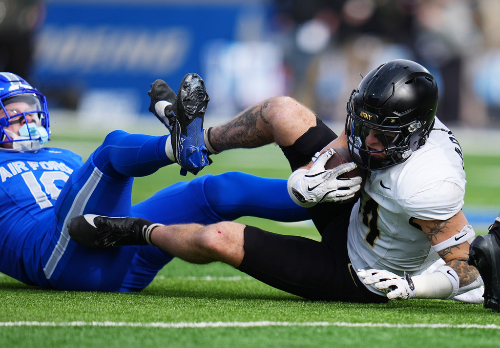 Army safety Gavin Shields (14) intercepts a pass intended for Air Force wide receiver Tre Roberson (10) during the second half of an NCAA college football game Saturday, Nov. 1, 2025, in Air Force Academy, Colo. (AP Photo/Jack Dempsey)