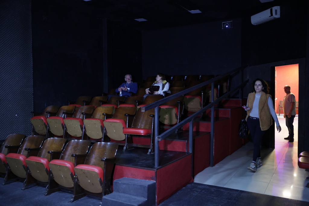 People waiting for a movie to start at the Cine LT3 built in an old parking garage in Sao Paulo, Thursday, Oct. 9, 2025. (AP Photo/Ettore Chiereguini)