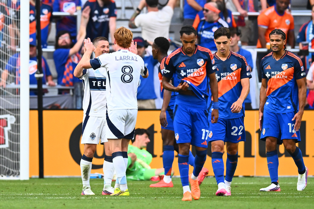 Vancouver Whitecaps FC midfielder Ryan Gauld, left, celebrates his first half goal with Oliver Larraz, right, during a match against FC Cincinnati in Cincinnati, Wednesday, July 22, 2026. (AP Photo/Ben Jackson)