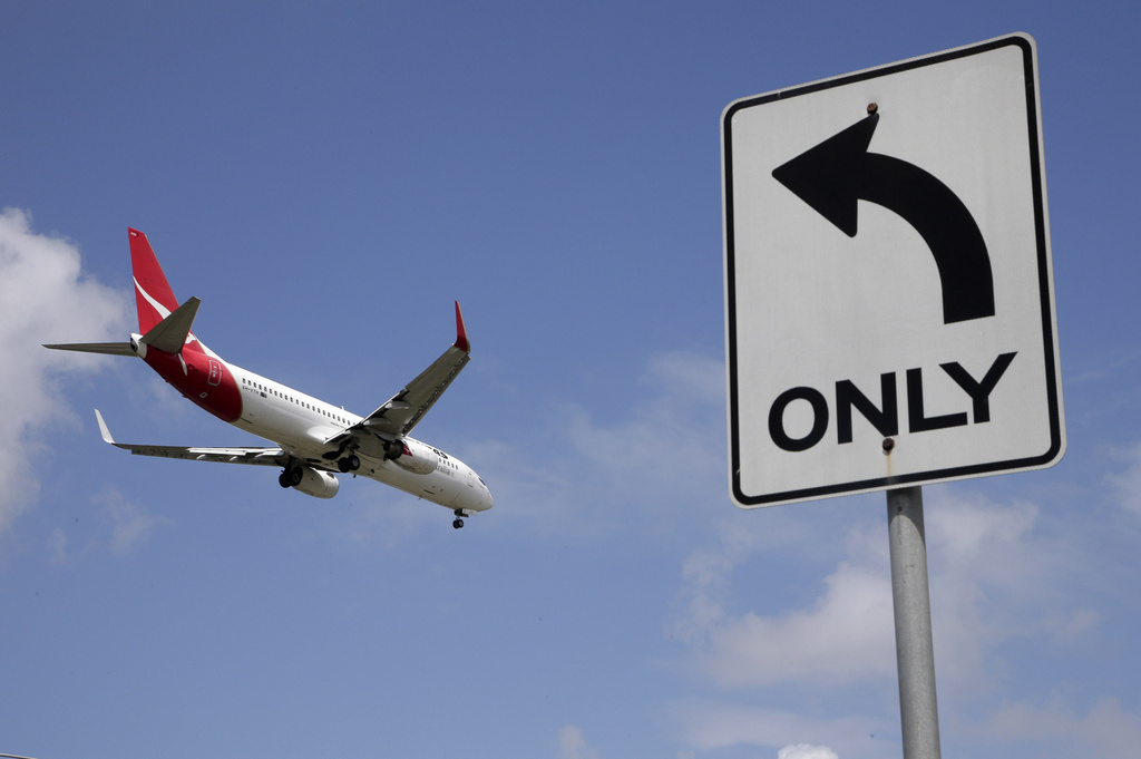 FILE - A Qantas plane prepares to land at Sydney Airport in Sydney, Australia, Feb. 21, 2013. (AP Photo/Rick Rycroft, File)