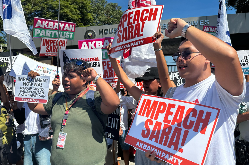 Protesters shout slogans during a rally calling for the impeachment of Philippine Vice President Sara Duterte outside the House of Representative in Quezon city, Philippines on Monday, May 11, 2026. (AP Photo/Joeal Calupitan)