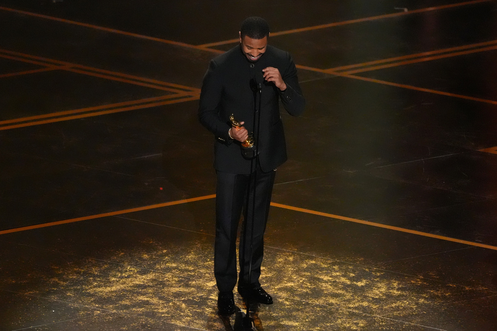Michael B. Jordan accepts the award for actor in a leading role for "Sinners" during the Oscars on Sunday, March 15, 2026, at the Dolby Theatre in Los Angeles. (AP Photo/Chris Pizzello)