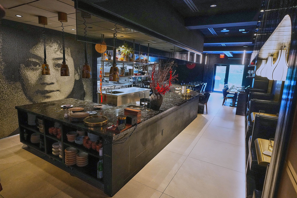 A mosaic likeness of owner Bolun Yao's grandmother Yingtao, for whom his establishment is named, adorns a wall at Michelin-starred Chinese restaurant in New York, Tuesday, Jan. 27, 2026. (AP Photo/Richard Drew)