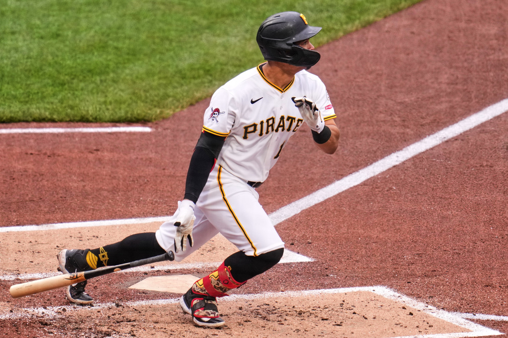 Pittsburgh Pirates' Endy Rodriguez singles off Colorado Rockies pitcher Chase Dollander, driving in two runs, during the third inning of a baseball game in Pittsburgh, Thursday, May 14, 2026. (AP Photo/Gene J. Puskar)