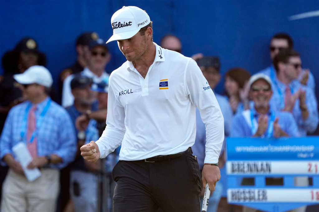 Michael Brennan reacts after winning the Wyndham Championship golf tournament in Greensboro, N.C., Sunday, Aug. 9, 2026. (AP Photo/Chuck Burton)