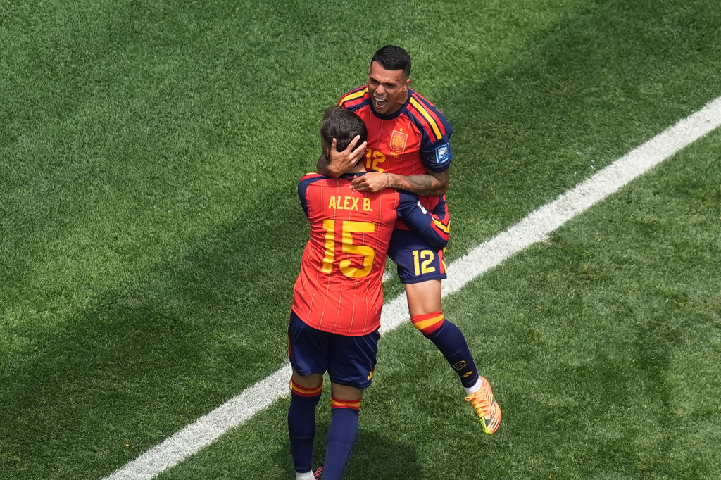 Spain's Pedro Porro (12) celebrates scoring his side's 2nd goal with Alex Baena during the World Cup round of 32 soccer match between Spain and Austria in Inglewood, Calif., near Los Angeles, Thursday, July 2, 2026. (AP Photo/Marcio J. Sanchez)