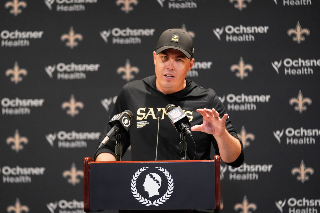 New Orleans Saints head coach Kellen Moore talks to reporters after an NFL football game against the New York Giants in New Orleans, Sunday, Oct. 5, 2025. (AP Photo/Gerald Herbert)