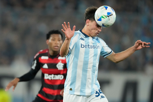 Facundo Mura of Argentina's Racing Club goes for a header during a Copa Libertadores semifinal second leg soccer match against Brazil's Flamengo in Buenos Aires, Argentina, Wednesday, Oct. 29, 2025. (AP Photo/Gustavo Garello) Facundo Mura of Argentina's Racing Club goes for a header during a Copa Libertadores semifinal second leg soccer match against Brazil's Flamengo in Buenos Aires, Argentina, Wednesday, Oct. 29, 2025. (AP Photo/Gustavo Garello)