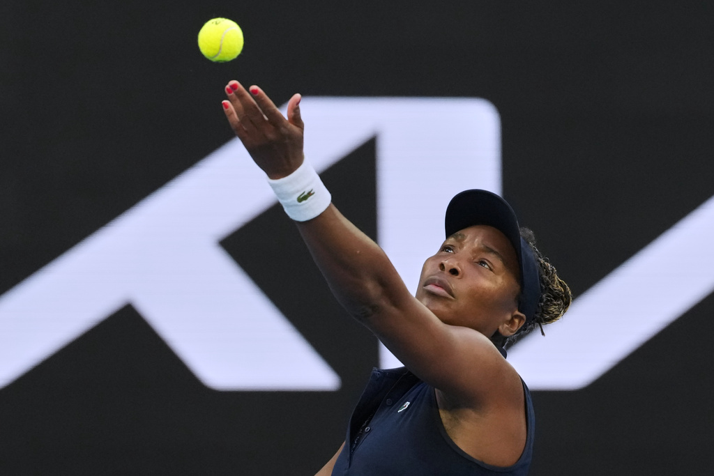 Venus Williams of the U.S. serves to Olga Danilovic of Serbia during their first round match at the Australian Open tennis championship in Melbourne, Australia, Sunday, Jan. 18, 2026. (AP Photo/Aaron Favila)