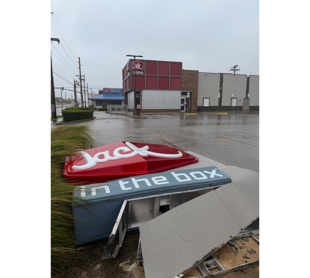The sign in front of Jack In the Box, in Tamuning, Guam, sits on the ground, Tuesday, April 14, 2026, as a super typhoon with ferocious winds and heavy rains is battering a group of remote U.S. islands in the Pacific Ocean. (Eric Rosario/Kandit News via AP)