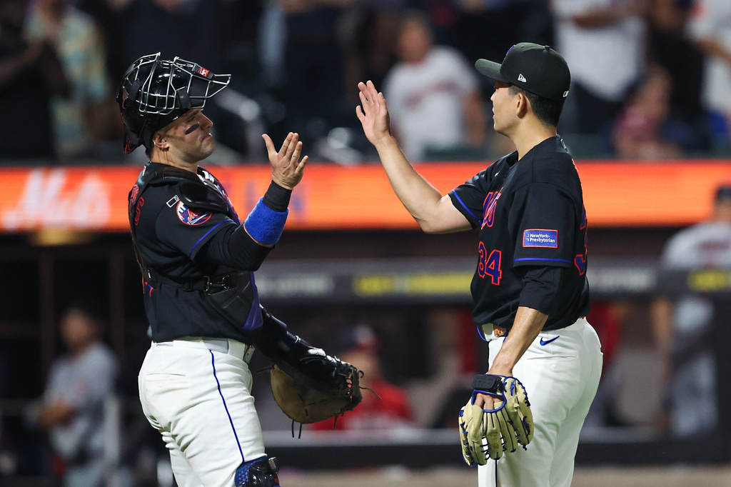 New York Mets pitcher Kodai Senga greets New York Mets catcher Luis Torrens after the ninth inning of a baseball game against the Washington Nationals, Friday, Aug. 14, 2026, in New York. (AP Photo/Heather Khalifa)