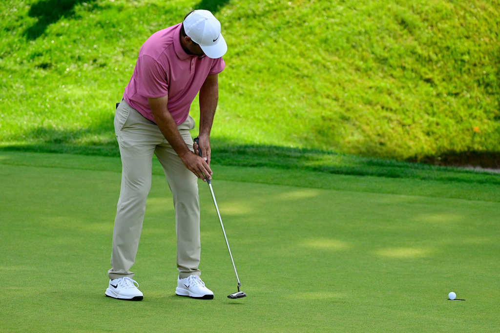 Scottie Scheffler misses his put on the first playoff hole of the Travelers Championship golf tournament at TPC River Highlands, Monday, June 29, 2026, in Cromwell, Conn. (AP Photo/Jessica Hill)