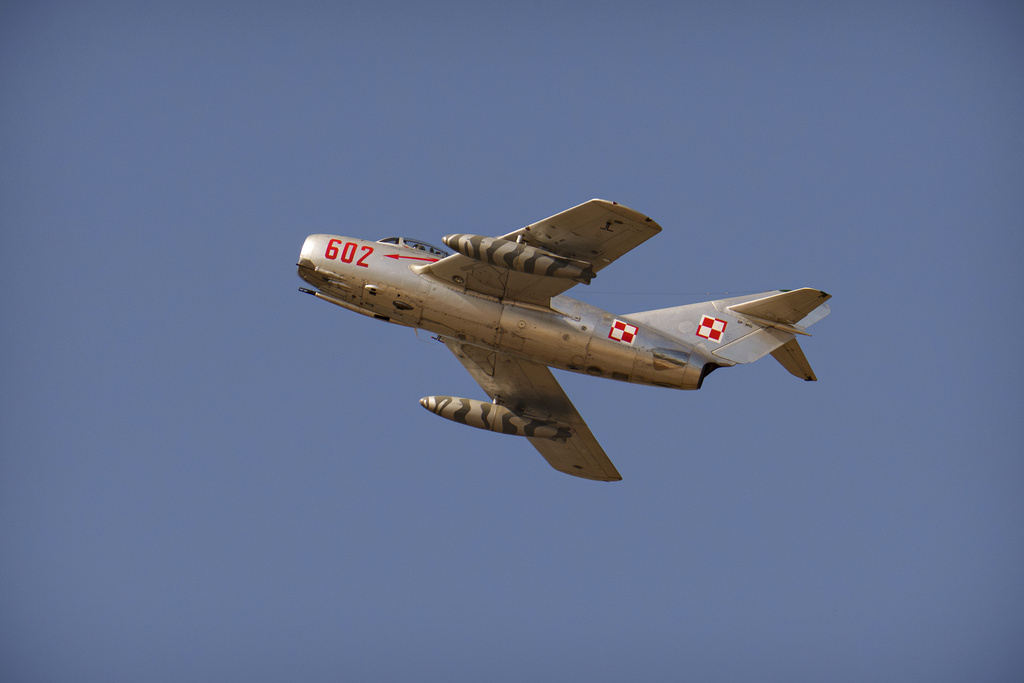 An MIG-15 fighter jet from Poland flies above the runway of the Aurel Vlaicu airport, on the first day of the Bucharest International Air Show, BIAS, in Bucharest, Romania, Saturday, Aug. 30, 2025. (AP Photo/Andreea Alexandru)