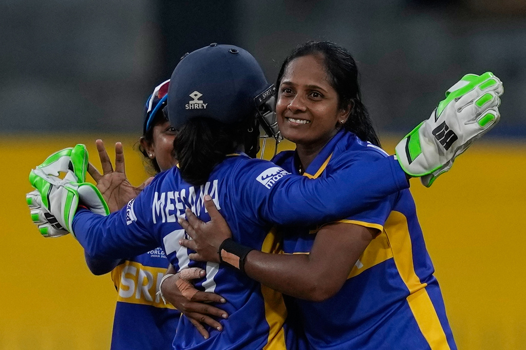 Sri Lanka's Inoka Ranaweera celebrates the wicket of England's Alice Capsey with teammates during the ICC Women's Cricket World Cup match between England and Sri Lanka at Premadasa Stadium in Colombo, Sri Lanka, Saturday, Oct. 11, 2025. (AP Photo/Eranga Jayawardena)