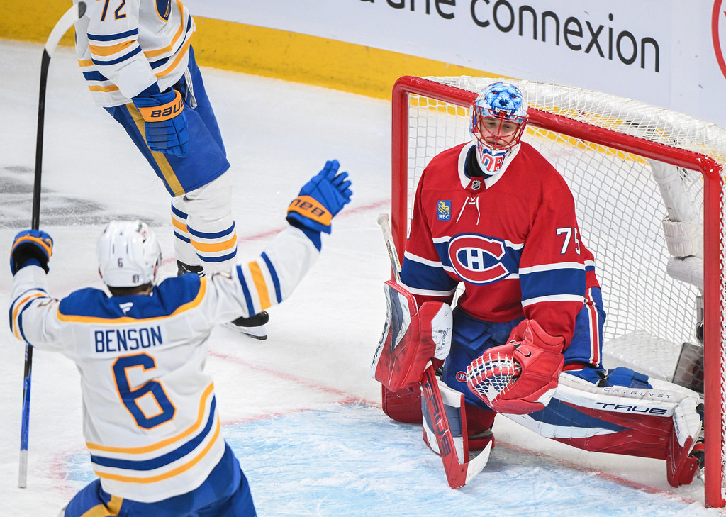 Buffalo Sabres' Zach Benson (6) reacts to a goal by teammate Tage Thompson against Montreal Canadiens goaltender Jakub Dobes (75) during second period, second round, game 4, NHL playoff hockey game in Montreal on Tuesday, May 12, 2026. (Graham Hughes/The Canadian Press via AP)