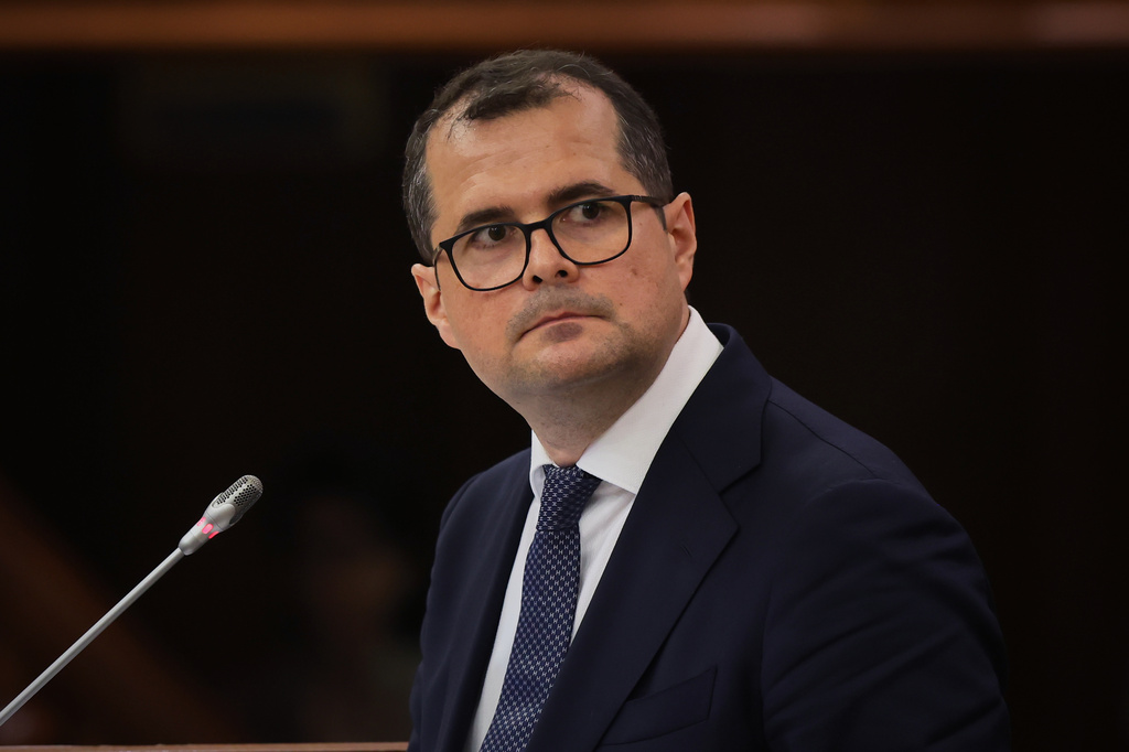 Prime Minister designate Vasile Tofan speaks before the parliament's confidence vote for the new government team in Chisinau, Moldova, Tuesday, July 21, 2026. (AP Photo/Aurel Obreja)