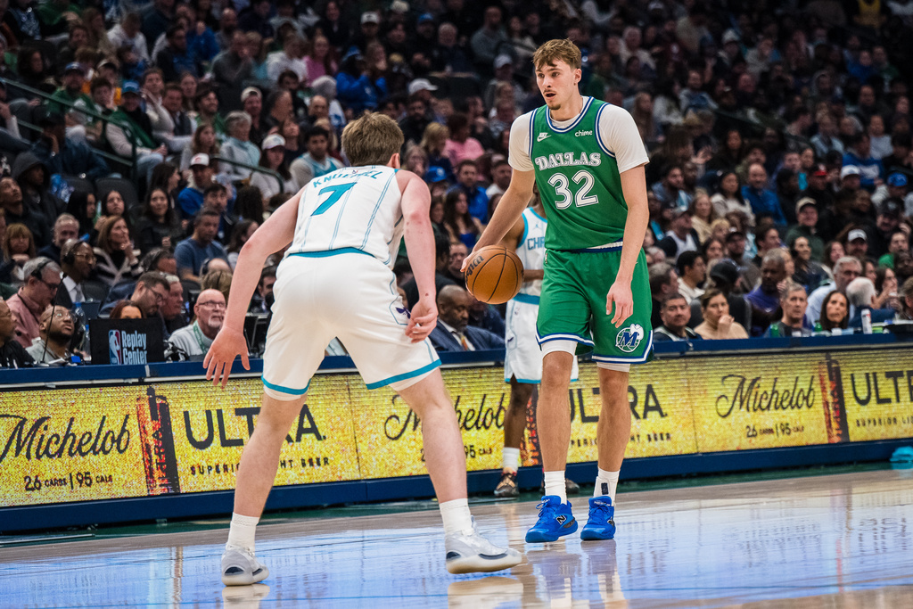 Dallas Mavericks forward Cooper Flagg (32) dribbles during an NBA basketball game against the Charlotte Hornets, Thursday, Jan. 29, 2026, in Dallas. (AP Photo/Jessica Tobias)