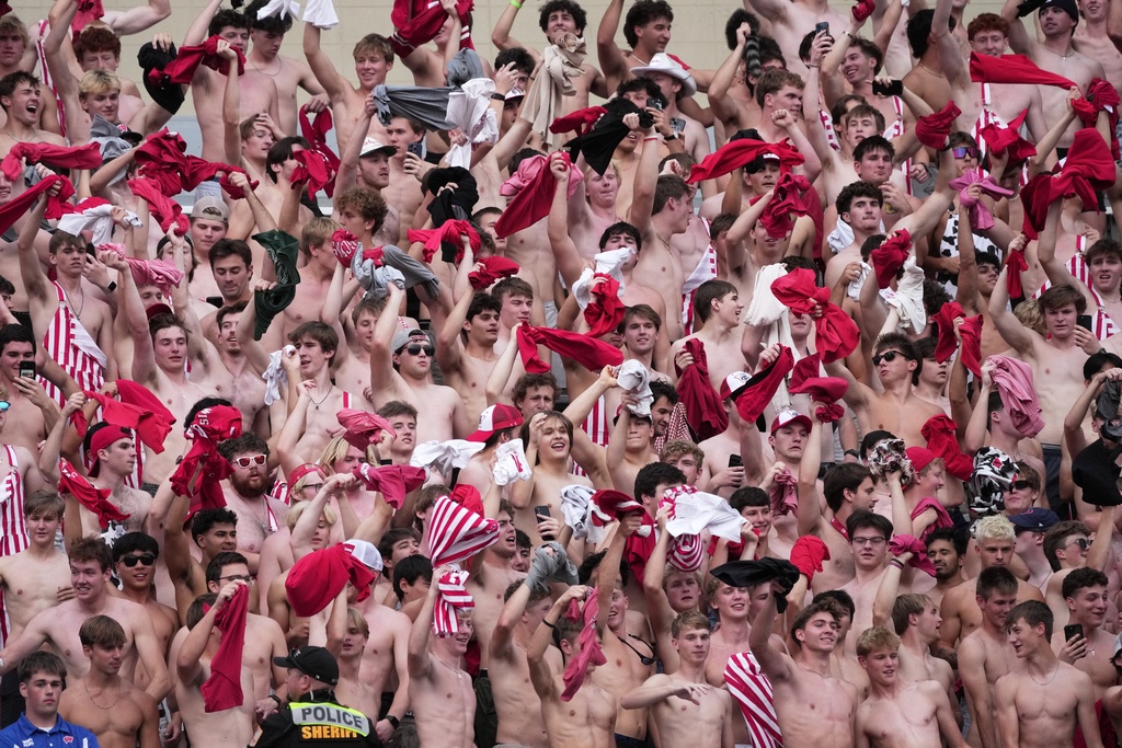 FILE - Fans dance during "Jump Around," during the second half of an NCAA college football game between the Wisconsin and the Ohio State, Saturday, Oct. 18, 2025, in Madison, Wis. (AP Photo/Morry Gash, File)