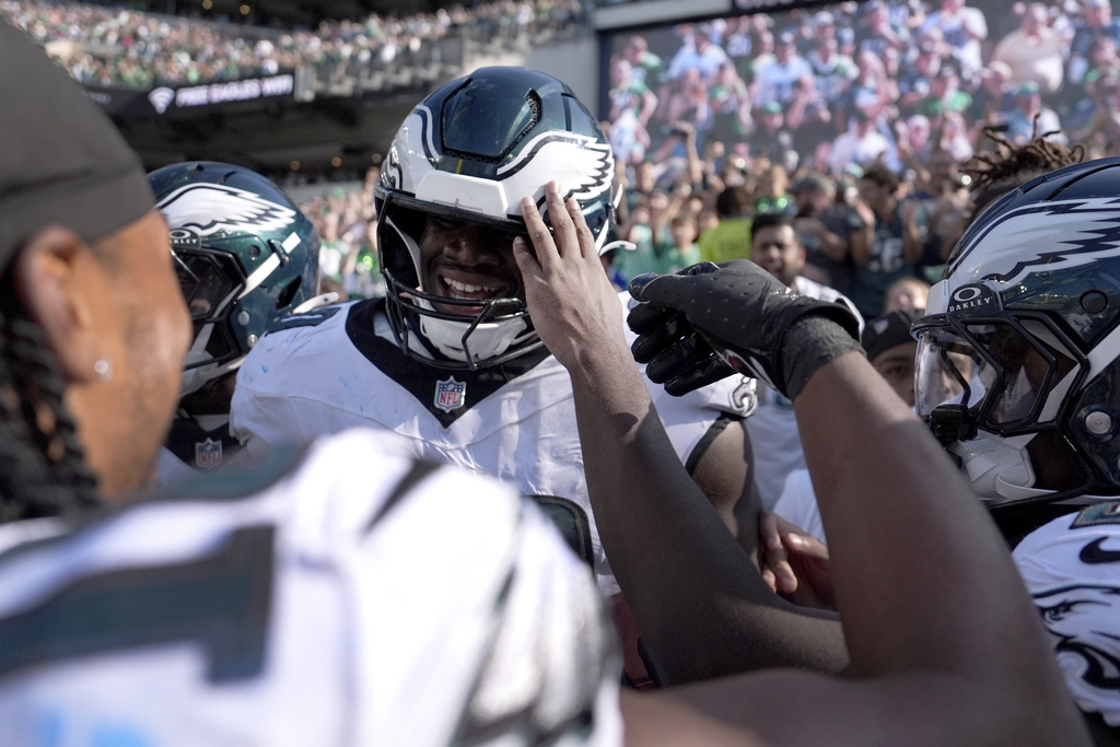 Philadelphia Eagles defensive tackle Jordan Davis (90) celebrates after blocking a field goal attempt and running it back for a touchdown as time expired in an NFL football game against the Los Angeles Rams Sunday, Sept. 21, 2025, in Philadelphia. (AP Photo/Matt Slocum)