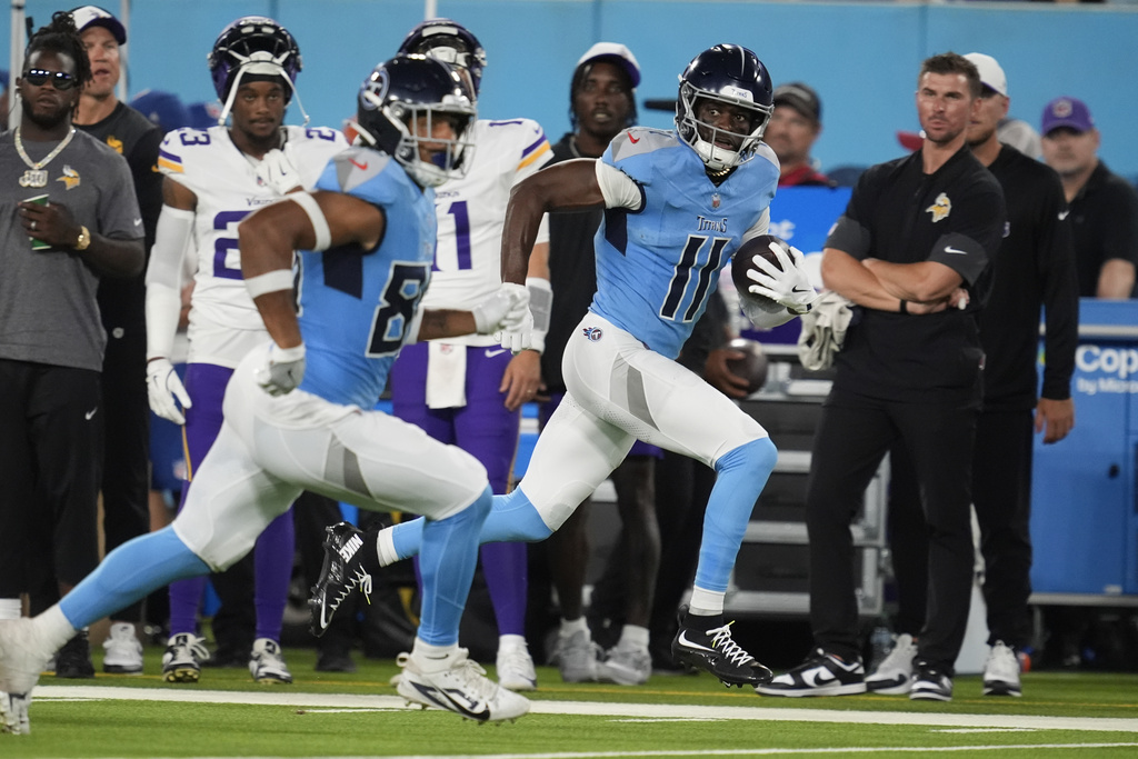 Tennessee Titans wide receiver Van Jefferson (11) runs for a touchdown after a catch against the Minnesota Vikings during the first half of a preseason NFL football game, Friday, Aug. 22, 2025, in Nashville, Tenn. (AP Photo/George Walker IV)