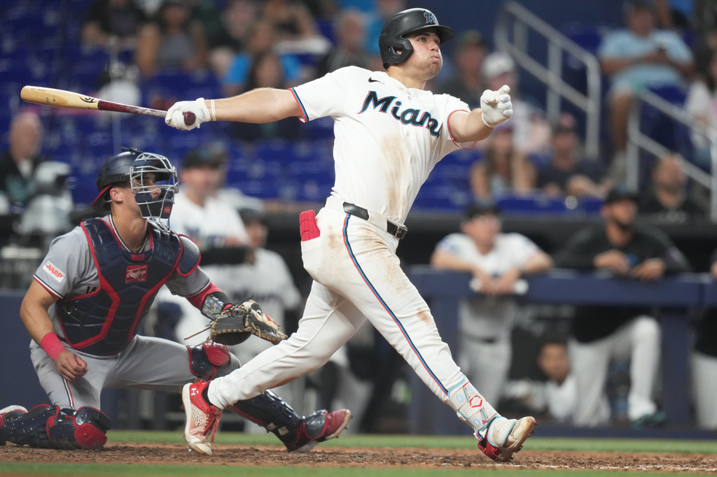 Miami Marlins' Jakob Marsee, right, watches after hitting a three run home run during the eighth inning of a baseball game against the Washington Nationals, Saturday, May 9, 2026, in Miami. (AP Photo/Lynne Sladky)