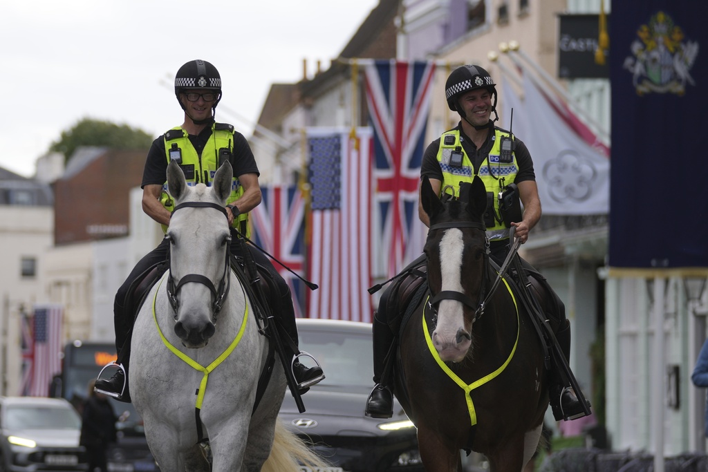 Police officers patrol outside the Windsor Castle in Windsor, England, Monday, Sept. 15, 2025, ahead of the state visit of U.S. President Donald Trump. (AP Photo/Kin Cheung)