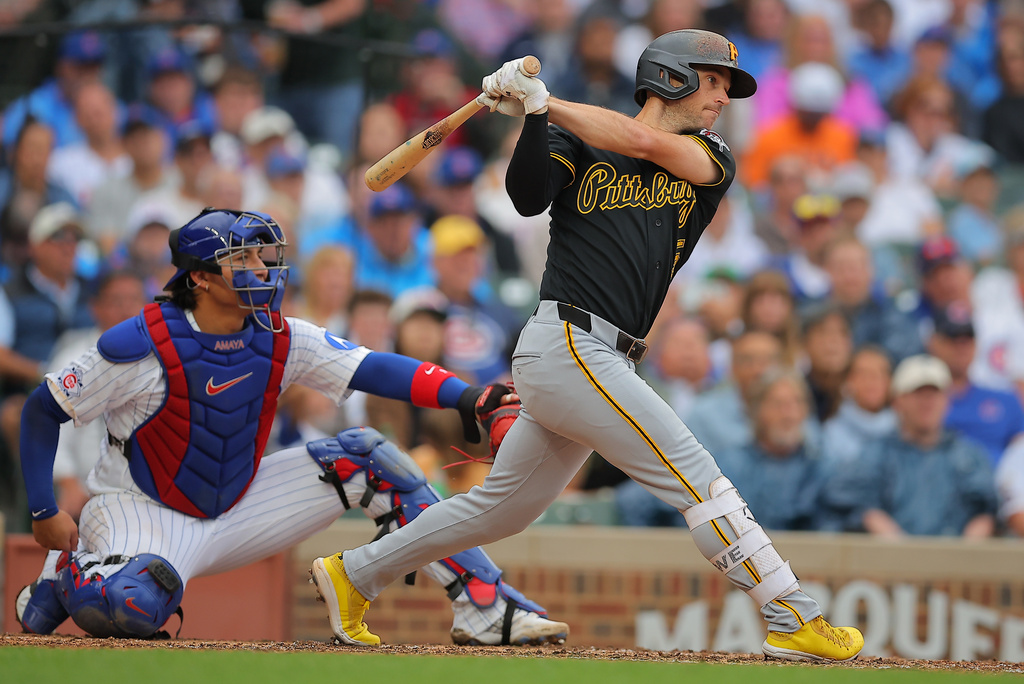 Pittsburgh Pirates' Brandon Lowe, right, watches his two-RBI single hit during the sixth inning of a baseball game against the Chicago Cubs, Sunday, Sept. 13, 2026, in Chicago. (AP Photo/Melissa Tamez)