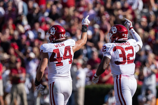 Oklahoma defensive lineman Taylor Wein (44) and defensive lineman R Mason Thomas (32) celebrate after an interception against South Carolina in an NCAA college football game Saturday, Oct. 18, 2025, in Columbia, S.C. (AP Photo/Scott Kinser) Oklahoma defensive lineman Taylor Wein (44) and defensive lineman R Mason Thomas (32) celebrate after an interception against South Carolina in an NCAA college football game Saturday, Oct. 18, 2025, in Columbia, S.C. (AP Photo/Scott Kinser)