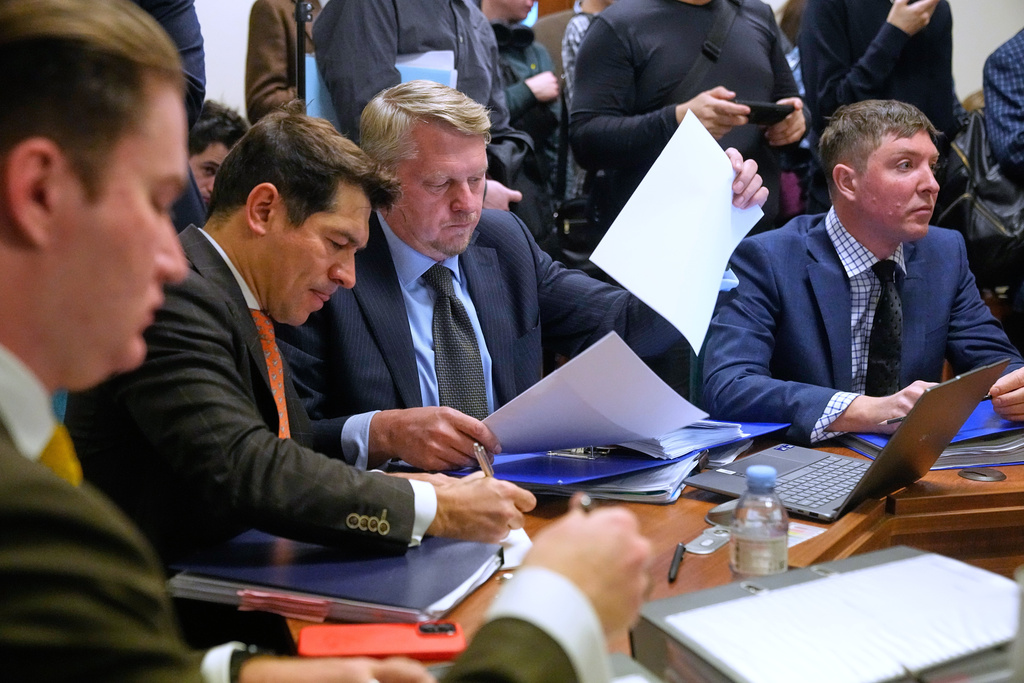 Participants gather in Moscow's Arbitration Court to hold a hearing to consider a lawsuit by Russia's Central Bank against Belgium-based financial clearinghouse Euroclear in Moscow, Russia, Friday, Jan. 16, 2026. (AP Photo/Pavel Bednyakov)