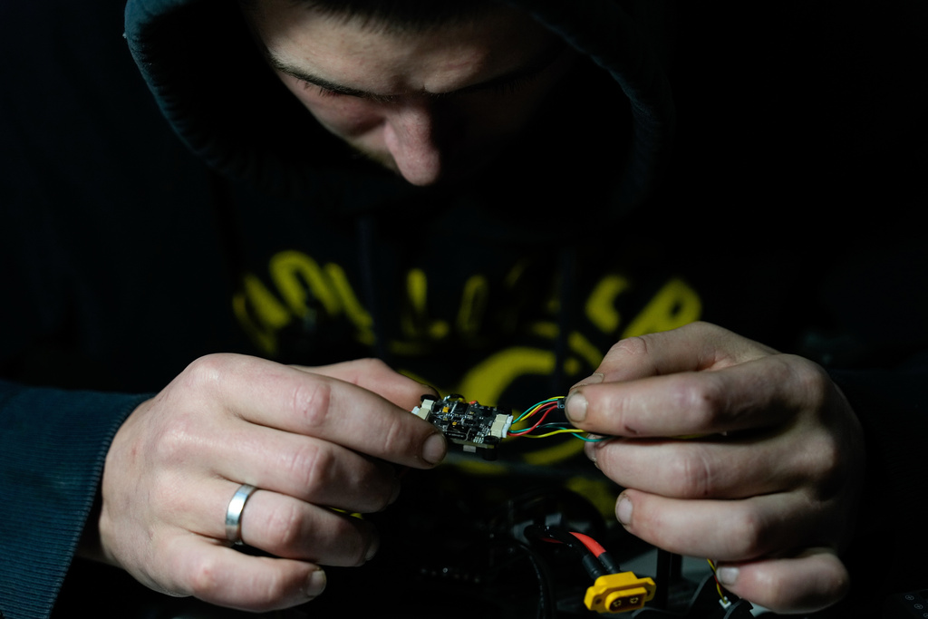 A Khartia brigade soldier assembles a drone, Friday, Nov. 7, 2025, in Kharkiv Oblast, Ukraine. (AP Photo/Julia Demaree Nikhinson)