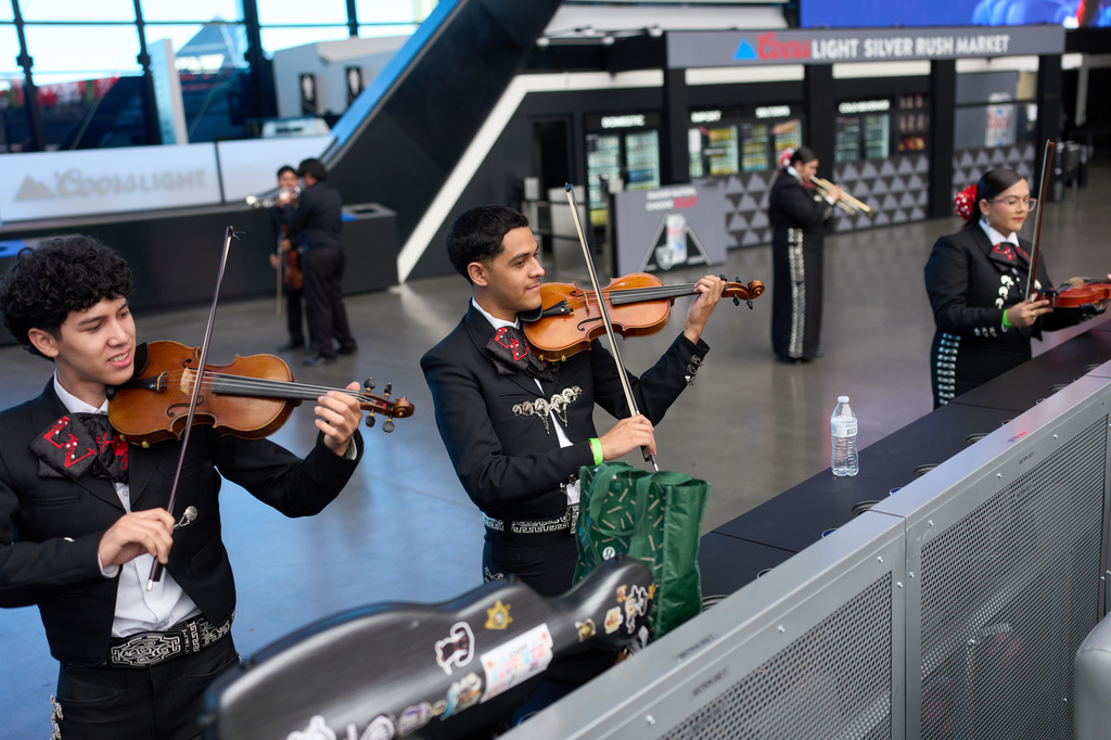Axel Rodr&iacute;guez Olivas, center, and Blanier Bojorquez, left, warm up with other University of Nevada, Las Vegas mariachi students before performing Saturday, Oct. 3, 2026, in Las Vegas. (AP Photo/John Locher)
