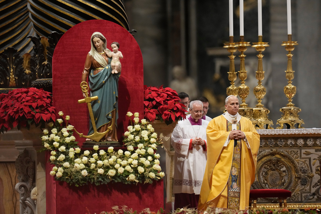 Pope Leo XIV celebrates the Christmas Eve Mass in St. Peter's Basilica at The Vatican, Wednesday, Dec.24, 2025. (AP Photo/Gregorio Borgia)
