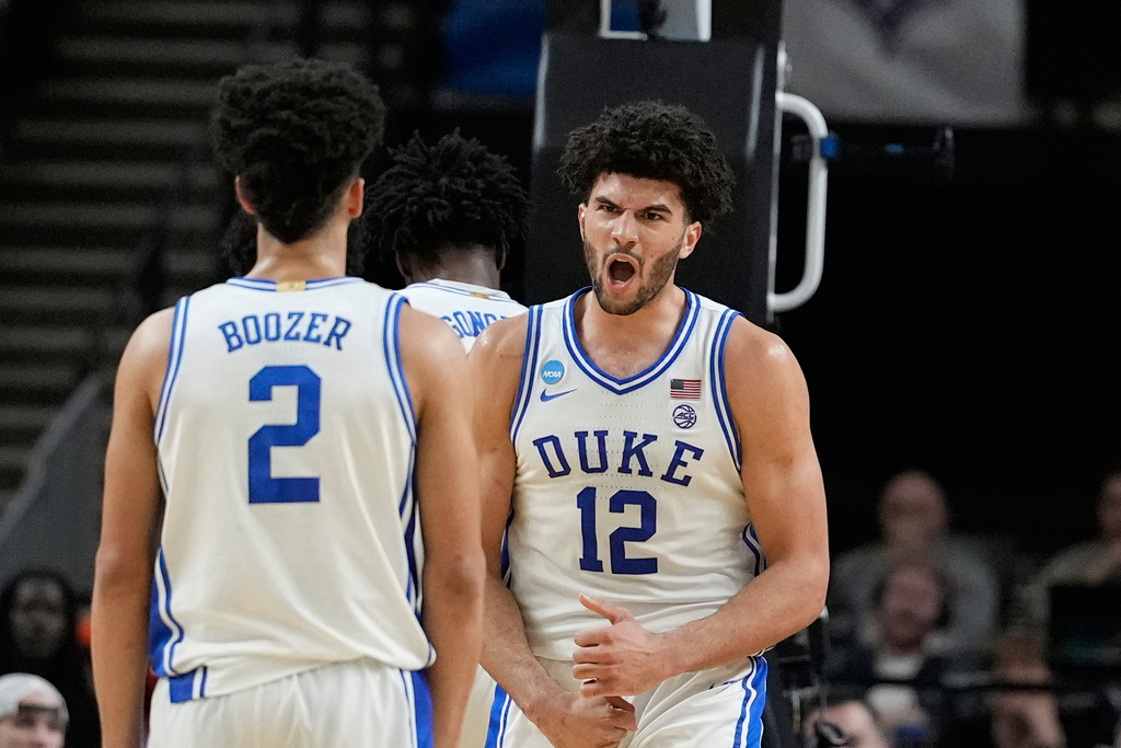 Duke forward Cameron Boozer (12) reacts after scoring during the second half in the second round of the NCAA college basketball tournament against TCU, Saturday, March 21, 2026, in Greenville, S.C. (AP Photo/Brynn Anderson)