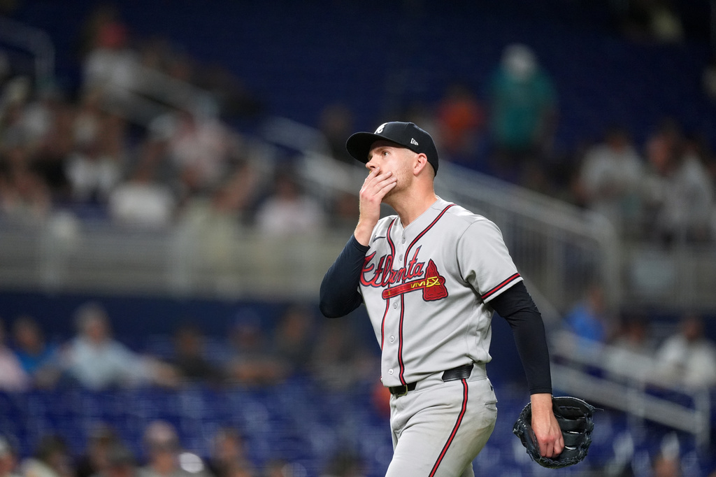 Atlanta Braves relief pitcher Aaron Bummer reacts as he leaves the field after pitching during the fifth inning of a baseball game against the Miami Marlins, Monday, May 18, 2026, in Miami. (AP Photo/Rebecca Blackwell)