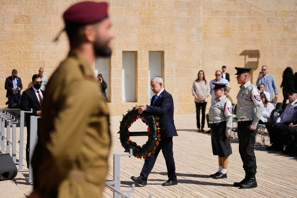 Israeli Prime Minister Benjamin Netanyahu lays a wreath at a ceremony marking the annual Holocaust Remembrance Day at the Yad Vashem Holocaust Memorial in Jerusalem Tuesday, April 14, 2026. (AP Photo/Ohad Zwigenberg)