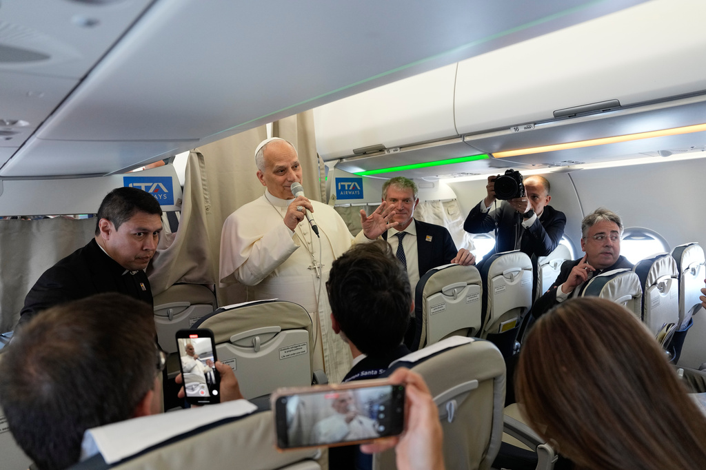 Pope Leo XIV talks to journalists aboard the papal flight from Rome to Madrid, Saturday, June 6, 2026, on the occasion of his apostolic journey to Spain. (AP Photo/Alessandra Tarantino, Pool)