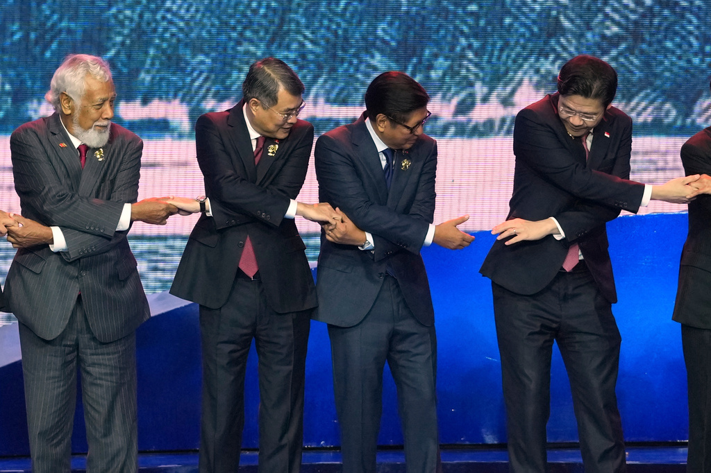 From left, East Timor's Prime Minister Xanana Gusmao, Vietnam's Prime Minister Le Minh Hung, Philippine President Ferdinand Marcos Jr. and Singapore's Prime Minister Lawrence Wong hold hands for a group photo during the opening ceremony of the 48th ASEAN Summit and Related Meetings in Cebu, Philippines on Friday, May 8, 2026. (AP Photo/Aaron Favila, Pool)